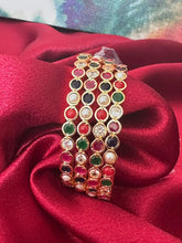 Gold plated bangles intricated with multicolored cubic zirconia stones