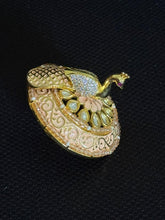 Polki kundan ring with cubic zirconia stone studded rotating peacock