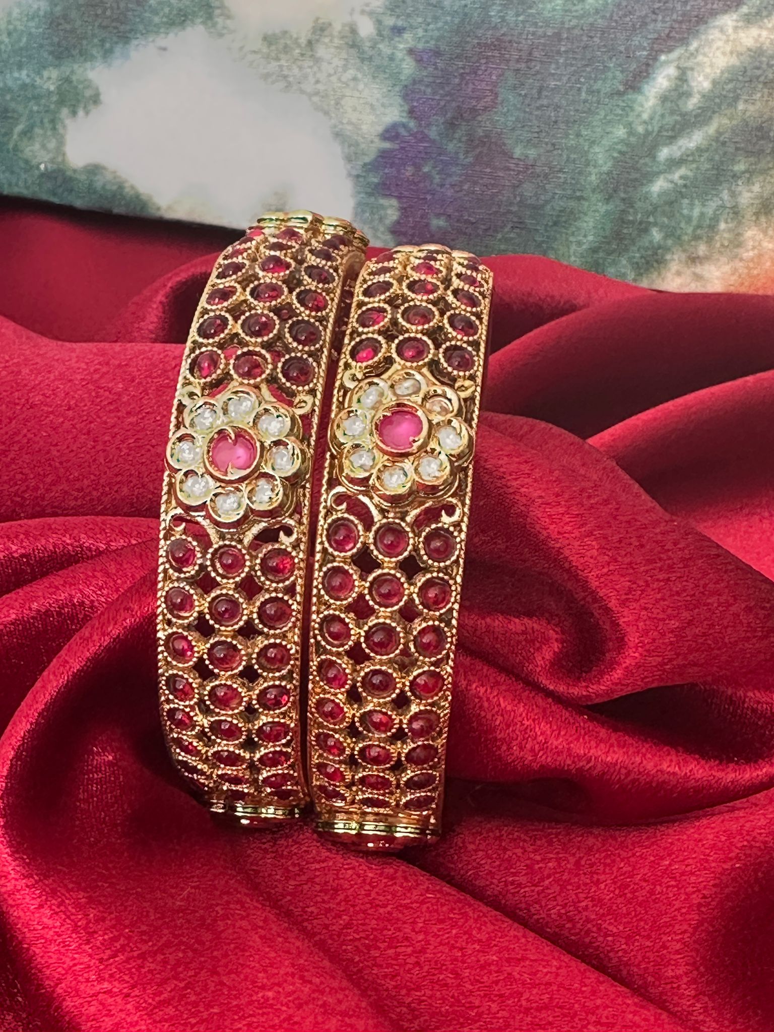 Gold plated bangles intricated with cubic zirconia stones and with Jaipuri foil kundan