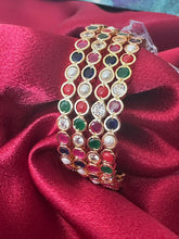 Gold plated bangles intricated with multicolored cubic zirconia stones