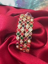 Gold plated bangles intricated with multicolored cubic zirconia stones