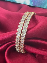 Gold plated bangles intricated with white cubic zirconia stones