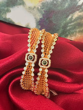 Gold plated square shaped bangles intricated with cubic zirconia stones