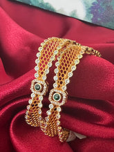 Gold plated square shaped bangles intricated with cubic zirconia stones